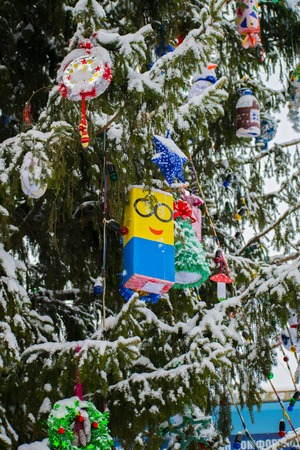 Christmas tree decorated with handmade toys. Decorated Christmas tree closeup.の写真素材