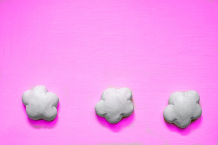 Three gingerbread gingerbread in white glaze on pink background with copy space.の写真素材
