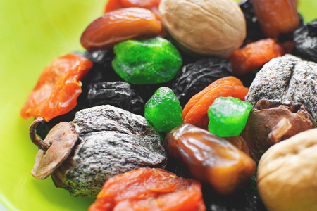 Dried persimmon, apricots, prunes kumquat dates and walnutsの写真素材