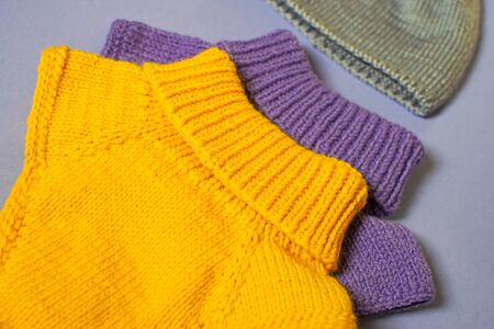 Woolen autumn or winter clothing. Top view sweater and hat for children.