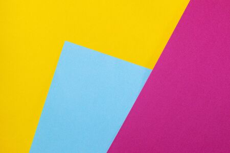 Color papers geometry flat composition. Background with yellow, blue and pink colors.