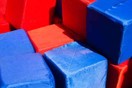 Red and blue soft rag cubes in the childrens playroomの写真素材
