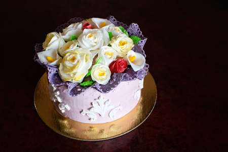 Beautiful birthday cake with mastic flowers decor.