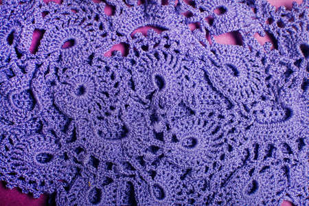 Delicate violet handmade lace doily. Knitted violet pattern. Color 2022.の写真素材