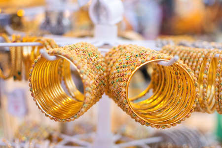Gold bracelets in a showcase at a bazaar in Dubai.