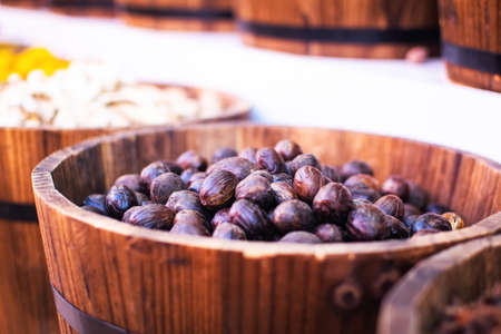 Fresh nutmeg in a Spice souk, Dubai, United Arab Emirates. Whole nuts.
