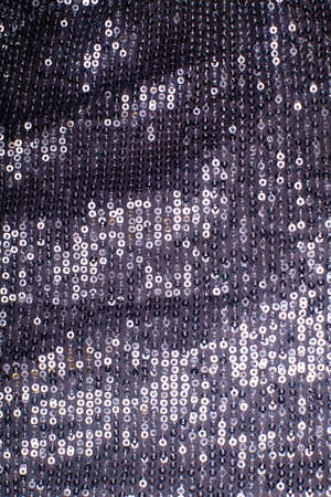 Pieces of cloth with silver sequins. Glitter background. Sequin textureの写真素材