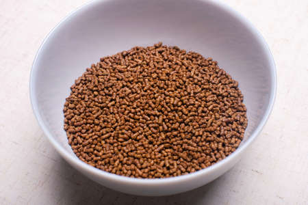 Healthy organic buckwheat tea in a gray bowl.