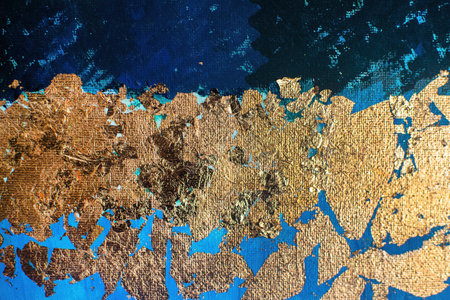 Gold-plated potal on blue textured canvas. Creative art on blue background.