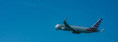 Zurich, Switzerland, Mart 2017 - Plane flying in deep blue sky. Bannerのeditorial素材