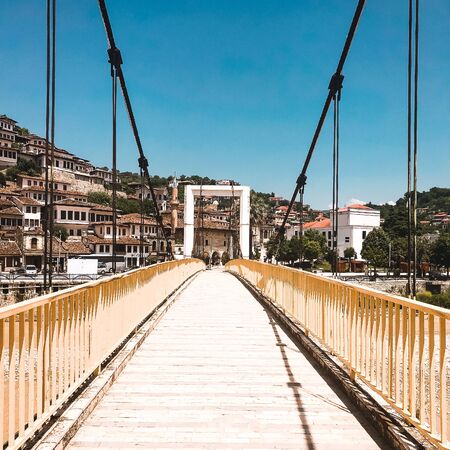 BERAT, ALBANIA - June, 2018: Pedestrian bridge over the Osum River in the old town of Beratのeditorial素材