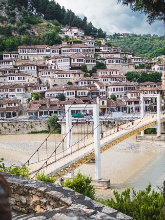 BERAT, ALBANIA - June, 2018: Pedestrian bridge over the Osum River in the old town of Beratのeditorial素材