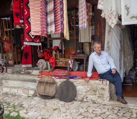 Kruje, Albania - June 2018: Traditional Ottoman market in Kruja, birth town of National Hero Skanderbeg. Flea market in Albania. Antique items and wool craft souvenirs for sale.のeditorial素材