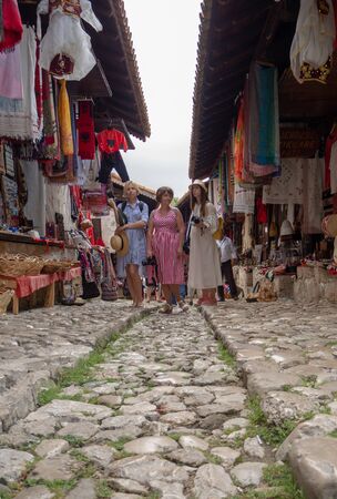 Kruje, Albania - June 2018: Traditional Ottoman market in Kruja, birth town of National Hero Skanderbeg. Flea market in Albania. Antique items and wool craft souvenirs for sale.のeditorial素材