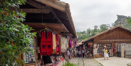 Kruje, Albania - June 2018: Traditional Ottoman market in Kruja, birth town of National Hero Skanderbeg. Flea market in Albania. Antique items and wool craft souvenirs for sale.のeditorial素材
