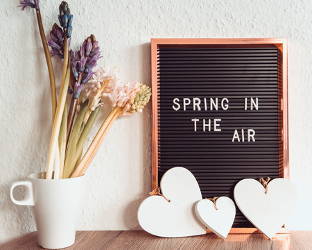 Spring is in the air text on dark and white background, inscription, copy spaceの写真素材