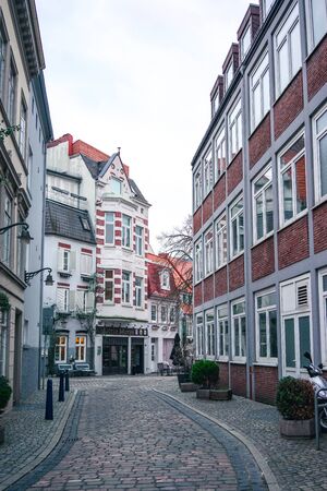 Bremen, Germany, January, 2019 - Colorful houses in historic Schnoorviertel at cloudy winter dayのeditorial素材