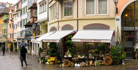 Zurich, Switzerland - March 2017: View of historic Zurich city center on a spring cloudy day, local food anf herb marketのeditorial素材