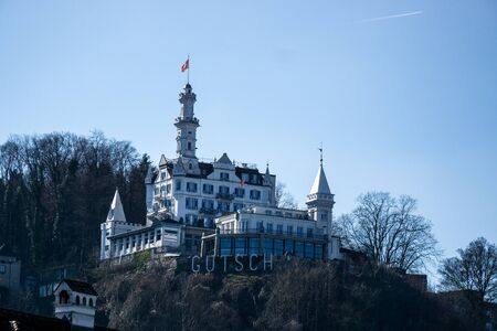 LUCERNE, SWITZERLAND - March, 2017: cityscape view of Chapel bridge and historic city center of Lucerne with famous lake Lucerne (Vierwaldstattersee) with beautiful reflections of houses in the waterのeditorial素材