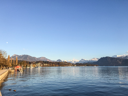View of lake Lucerne with the view of mountains and Swiss Alps in the background, sunny dayの写真素材