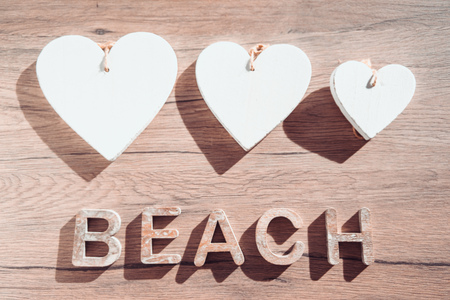 Summer Bacground With Beach Accessories On Wooden Board. White heart.の写真素材