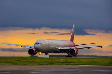 Moscow, Russia, July 2017 - Vnukovo International Airport. White passenger plane takes off from the airport runway. Airplane front view.のeditorial素材