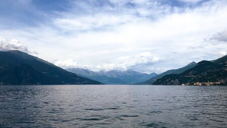 View above big beautiful lake, Como lake, Italy. Summer cloudy view.