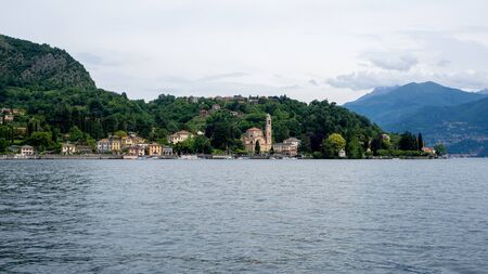 View above big beautiful lake, Como lake, Italy. Summer cloudy view. With stony shore, bannerの写真素材