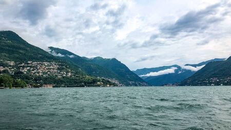 View above big beautiful lake, Como lake, Italy. Summer cloudy view.