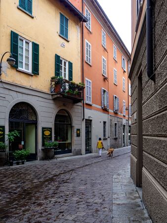 Como, ITALY - MAY, 2018: People on a cozy streets of Como cityのeditorial素材