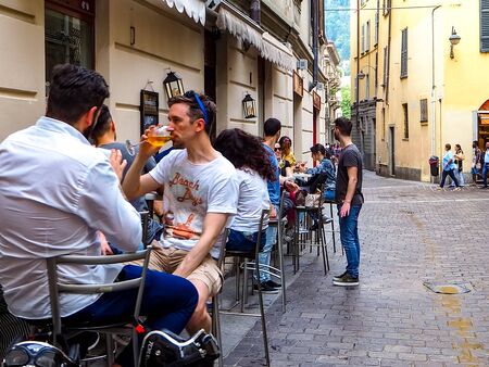 Como, ITALY - MAY, 2018: People on a cozy streets of Como cityのeditorial素材