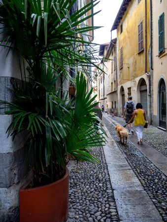 Como, ITALY - MAY, 2018: People on a cozy streets of Como cityのeditorial素材
