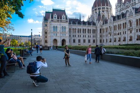 Budapest. Hungary, September 2019 - people taking photos near the dome of Hungarian Parliament buildingのeditorial素材