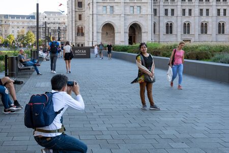 Budapest. Hungary, September 2019 - people taking photos near the dome of Hungarian Parliament buildingのeditorial素材