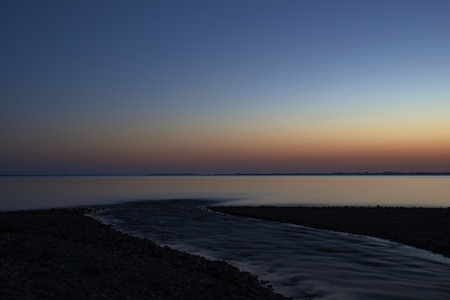 beautiful and silent evening at vadum beach after sunset in Denmarkの写真素材