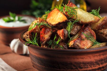 baked potatoes with greens and country-style vegetables in the morning light