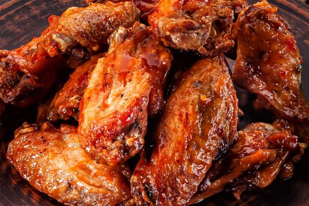 grilled chicken wings in red sauce close-upの写真素材
