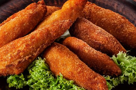 chicken nuggets in a plate on a lettuce leaf close-upの写真素材