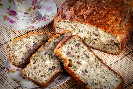 baked pie with sliced slices in the foreground close-upの写真素材