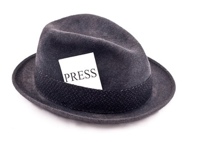 An old fedora felt hat with press cardの写真素材