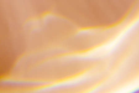 Beautiful lights and shadows on beige background. Overlay mode. Caustic effect of light. Shadows...