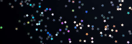 Festive black paper background with many many silver stars. Christmas, New Year or Birthday theme concept. An ideal backdrop for your banner or web design. Banner for happy holidays presentationの写真素材