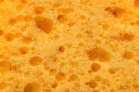 Foam sponge texture in macro. Textured background. Dishwashing or car cleaning concept. Abstract...