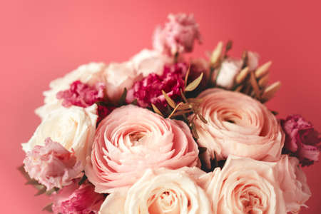 Bright pink flowers bouquet closeup. Roses and orchids wallpaper. Beautiful background for a Birthday, International Female Day, or Saint Valentine. The festive backdrop for a postcard designの写真素材