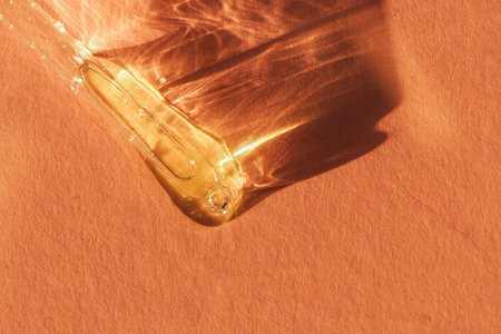 Pipette with transparent fluid hyaluronic acid or serum. Cosmetics, science and healthcare concept...