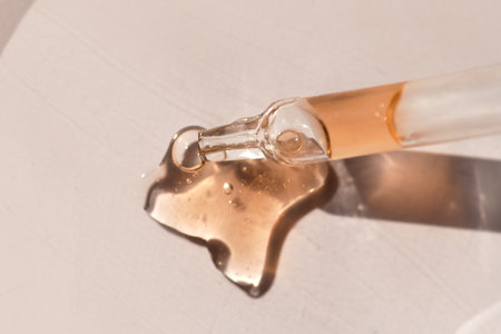 Pipette with fluid serum, oil, face gel cleaner. Cosmetics and healthcare concept. Dose of retinol...