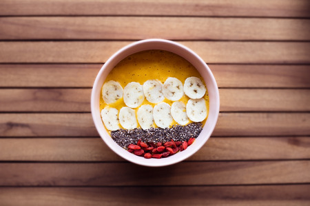 Smoothie Bowl on a wooden tableの写真素材