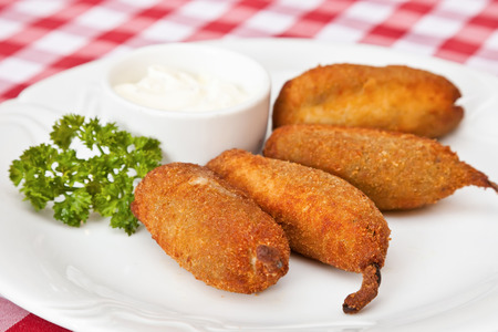 Deep-fried Jalapeno chili pepper with mayonnaise and parsleyの写真素材