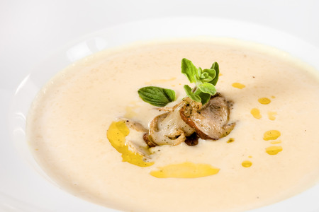Creamy potato soup with mushrooms and salmonの写真素材