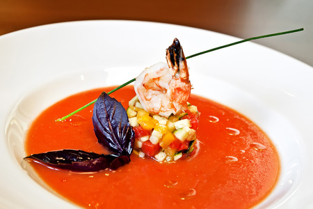 Andalusian spicy soup with shrimp, vegetables and basilの写真素材